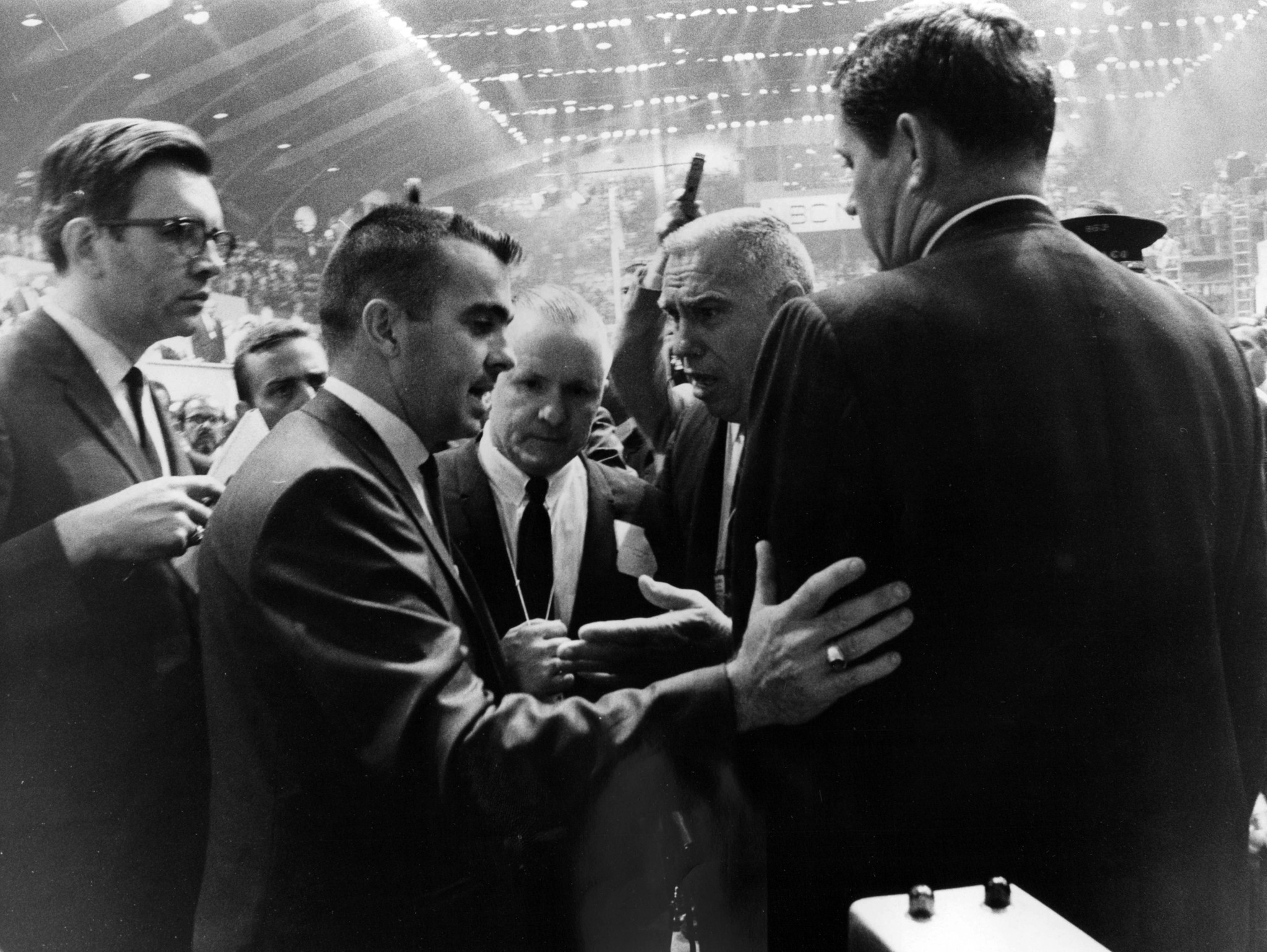 A Georgia delegate is grabbed by security after he tried...