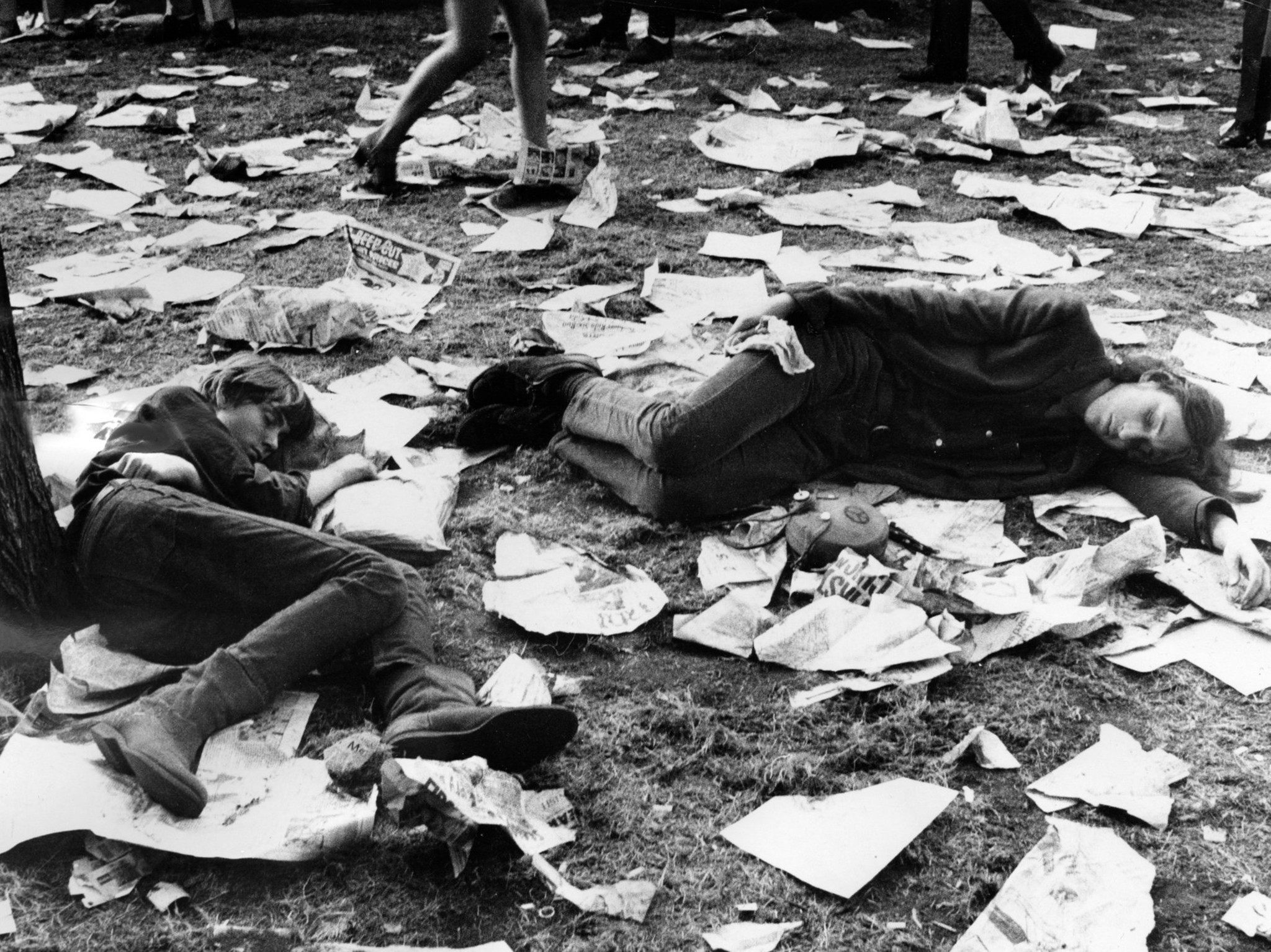 Demonstrators sleep before the next night's confrontation with police and...