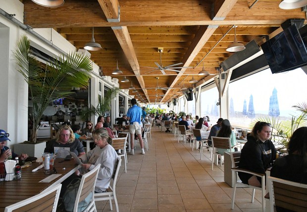 CoastAL is a beachy brunch spot with fresh seafood, pastries, and massive cinnamon rolls. (Linze Rice/For the Tribune)