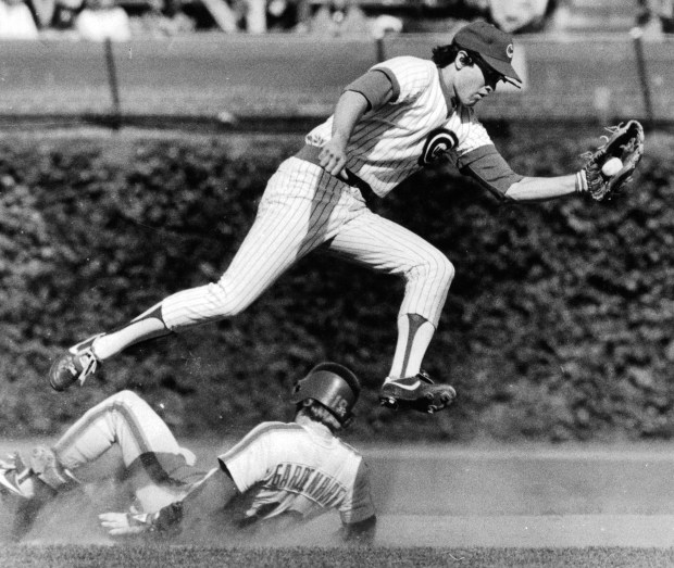 Cubs rookie second baseman Ryne Sandberg gloves catcher Butch Benton's throw after the Mets Ron Gardenhire steals second in September of 1982 at Wrigley Field. (Phil Mascione/Chicago Tribune)