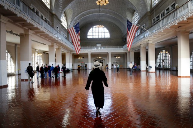 A park ranger walks through the registry room on Ellis Island in New York, Oct. 28, 2013. (Seth Wenig/AP)