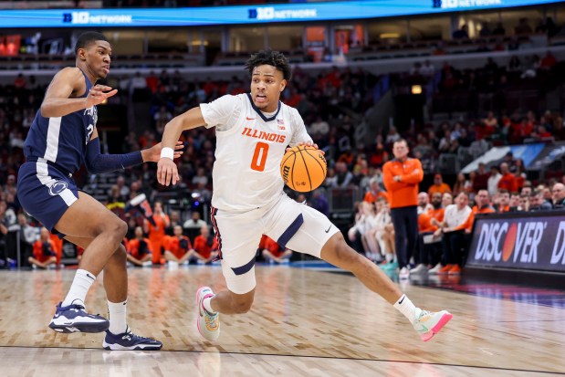 Penn State Nittany Lions forward Kebba Njie (3) guards Illinois Fighting Illini guard Terrence Shannon Jr. (0) in the first half during the Big Ten Tournament at the United Center on March 9, 2023, in Chicago. (Armando L. Sanchez/Chicago Tribune)