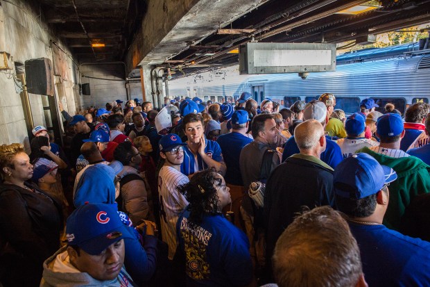 Metra commuters wait for a train at crowded Van Buren station after celebrating the World Series champion Chicago Cubs after the parade and rally in Grant Park in Chicago on Nov. 4, 2016. (Zbigniew Bzdak/Chicago Tribune)