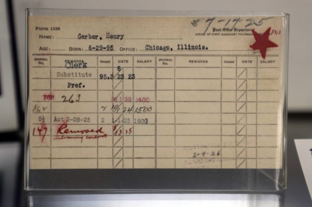 A card noting Henry Gerber's removal from employment with the Post Office is on display at the Gerber/Hart Library and Archives in Chicago on March 25, 2022. (Terrence Antonio James/Chicago Tribune)