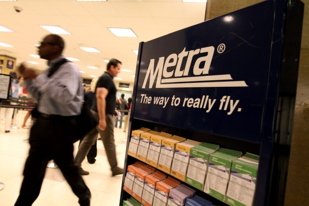 Commuters pass a Metra display at Union Station on June 5, 2012, the year of a big fare increase. (Phil Velasquez/Chicago Tribune)