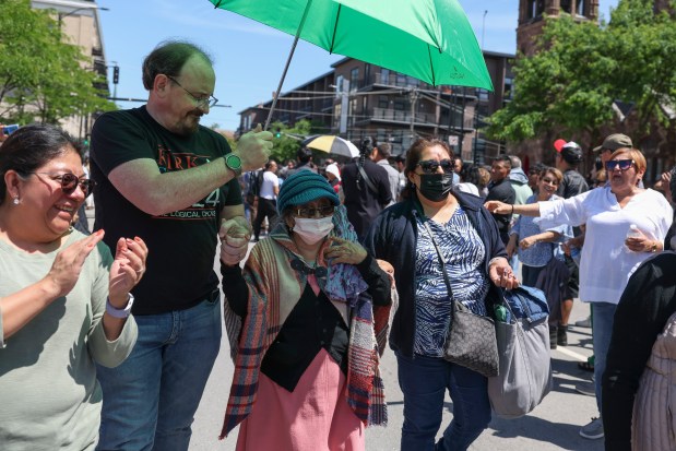 Robertina Zetina Sanchez, 97, walks with family after traveling from Madison, Wis., to vote in the Mexican presidential election at the Consulate General of Mexico in Chicago on June 2, 2024. (Eileen T. Meslar/Chicago Tribune)