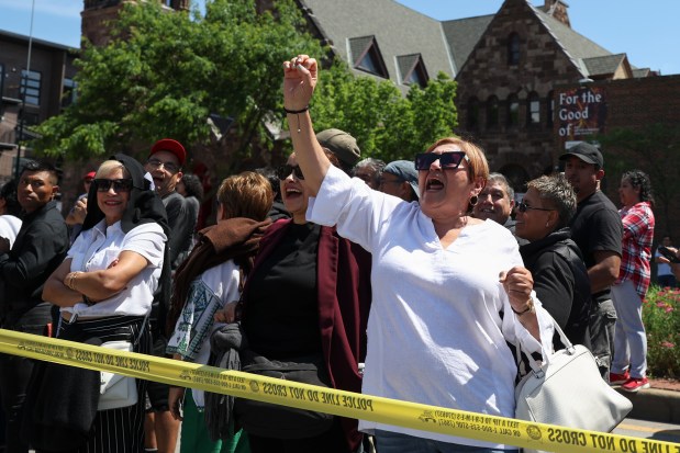 Edith Cortez cheers as she waits in line on Ashland Avenue outside the Consulate General of Mexico in Chicago to vote in the Mexican presidential election on June 2, 2024. (Eileen T. Meslar/Chicago Tribune)