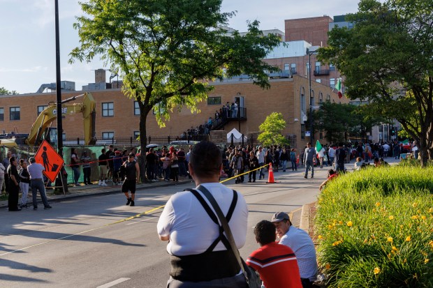 People wait outside the Mexican Consulate to vote in Mexico's presidential election on June 2, 2024, in Chicago. Mexico is expected to elect its first woman president in the election between center-right Xóchitl Gálvez and left-wing Claudia Sheinbaum. (Armando L. Sanchez/Chicago Tribune)