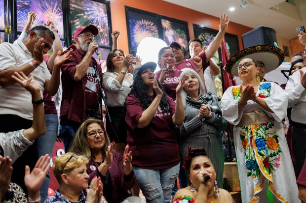 People cheer during a Mexico presidential election watch party at Mi Tierra En La Villita Sunday June 2, 2024, in Chicago. (Armando L. Sanchez/Chicago Tribune)