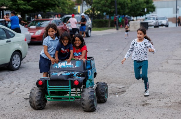 Children play near a migrant shelter on the Lower West Side on June 12, 2024, in Chicago. (Armando L. Sanchez/Chicago Tribune)