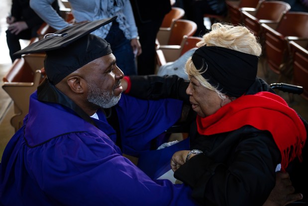 Michael Broadway has an emotional reunion with his mother Elizabeth Broadway before his commencement from the Northwestern Prison Education Program at Stateville Correctional Center on Nov. 15, 2023. The graduating class became the first incarcerated students to earn bachelor's degrees from a top 10 university. (E. Jason Wambsgans/Chicago Tribune)