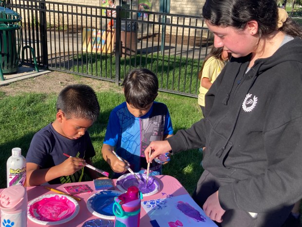 Two youngsters work on their foam stamping project. (Steve Sadin/For the Lake County News-Sun)