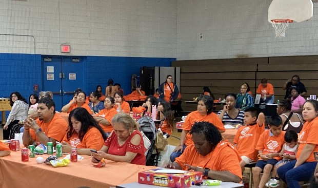 Participants in the Boys & Girls Club of Lake County's gun violence prevention event wear the orange shirts they received at Friday's event. (Steve Sadin/For the Lake County News-Sun)