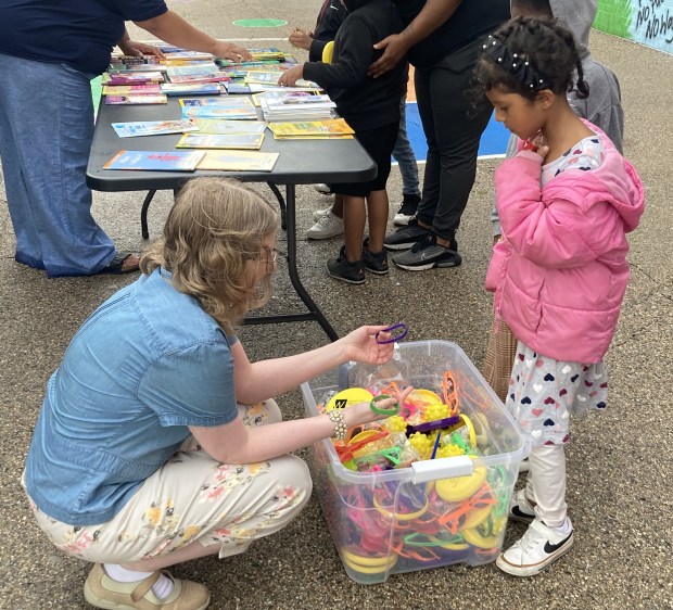 A child selects a toy during a visit of the Waukegan Public Library van to Washington Elementary School. (Steve Sadin/For the Lake County News-Sunv