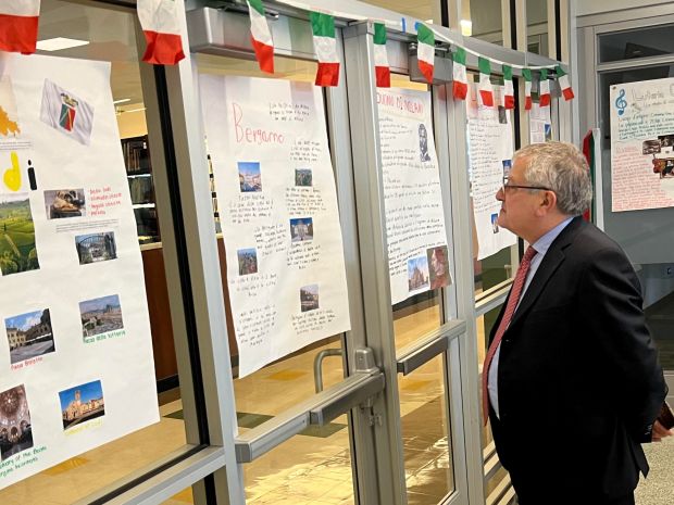 Paolo Sensale, spokesperson for Attilio Fontana, president of Italy's Lombardy region, looked at projects done by Italian students at Ridgewood High School in Norridge during an educational exchange visit recently. (Elena Ferrarin)