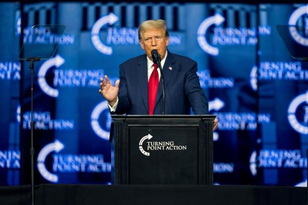 Former President Donald Trump speaks during the Turning Point Action conference in Detroit, June 15, 2024. The Republican convention will be held in swing-state Wisconsin's largest city. The nominee, however, had planned to stay his own hotel in Chicago, until reporters began inquiring. (Nic Antaya/The New York Times)