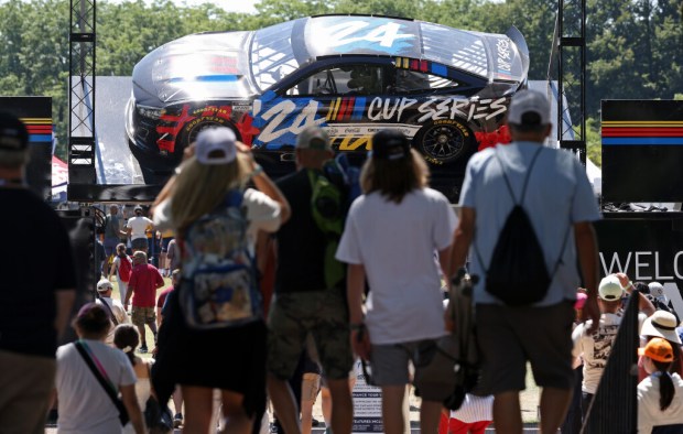 Fans approach the entrance to NASCAR Village at Butler Field before the Xfinity Series race Saturday, July 6, 2024, in Chicago. (John J. Kim/Chicago Tribune)