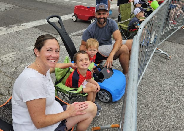 Katie and Nicholas Blatti of Aurora came to the Fourth of July parade in Aurora on Thursday with their sons "because we're proud Americans." (David Sharos / For The Beacon-News)