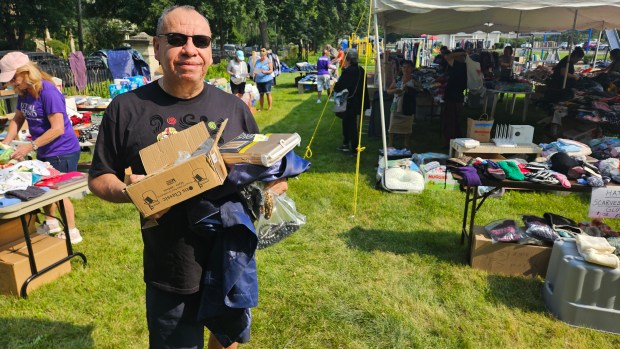 Lalo Torres of Aurora said he worked as a volunteer last year at the annual Mutual Ground yard sale and that he returned as a shopper this year "to support the community." (David Sharos / For The Beacon-News)