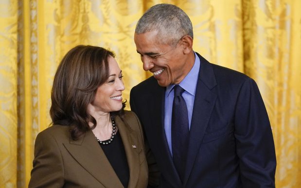 Former President Barack Obama talks with Vice President Kamala Harris during an event about the Affordable Care Act, in the East Room of the White House in Washington, April 5, 2022. (AP Photo/Carolyn Kaster, File)