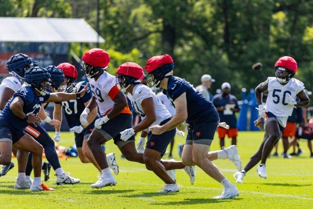 Bears defense and offense run a play during training camp at Halas Hall on July 20, 2024. (Tess Crowley/Chicago Tribune)