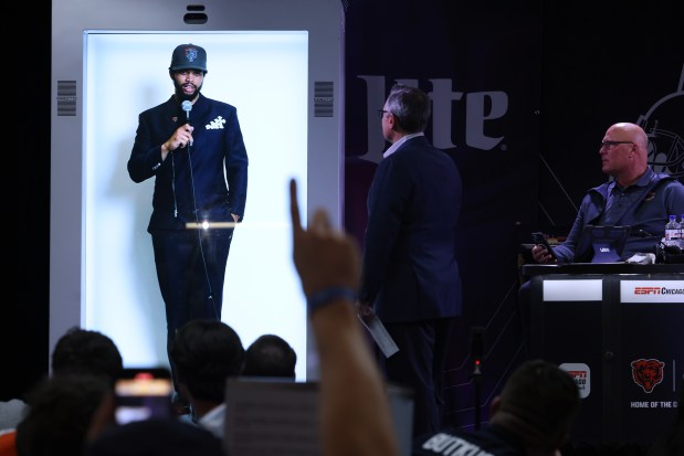 Chicago Bears no. 1 draft pick Caleb Williams of USC is displayed by way of hologram as he gives an interview during the Bears draft watch party at Soldier Field on April 25, 2024, in Chicago. (John J. Kim/Chicago Tribune)