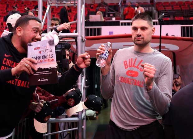 Bulls center Nikola Vučević arrives on court to warm up for a play-in game against the Hawks at the United Center on April 17, 2024. (Chris Sweda/Chicago Tribune)