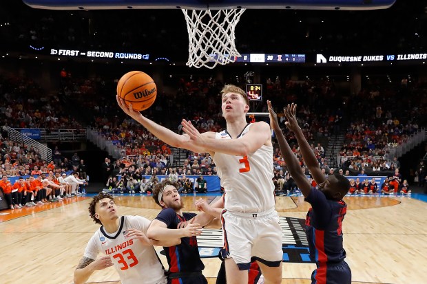 Illinois' Marcus Domask drives to the basket during the first half in an NCAA Tournament game on March 23, 2024 in Omaha, Neb. (Photo by Michael Reaves/Getty Images)