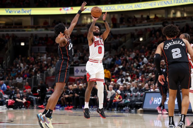 Bulls guard Coby White shoots a three-point-basket during the third quarter against the Detroit Pistons at the United Center Nov. 12, 2023 in Chicago. (Armando L. Sanchez/Chicago Tribune)