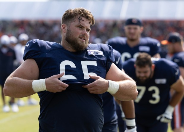 Chicago Bears guard Coleman Shelton (65) airs out his jersey during a full-pads practice at the Chicago Bears training camp on July 26, 2024, in Lake Forest. (Stacey Wescott/Chicago Tribune)