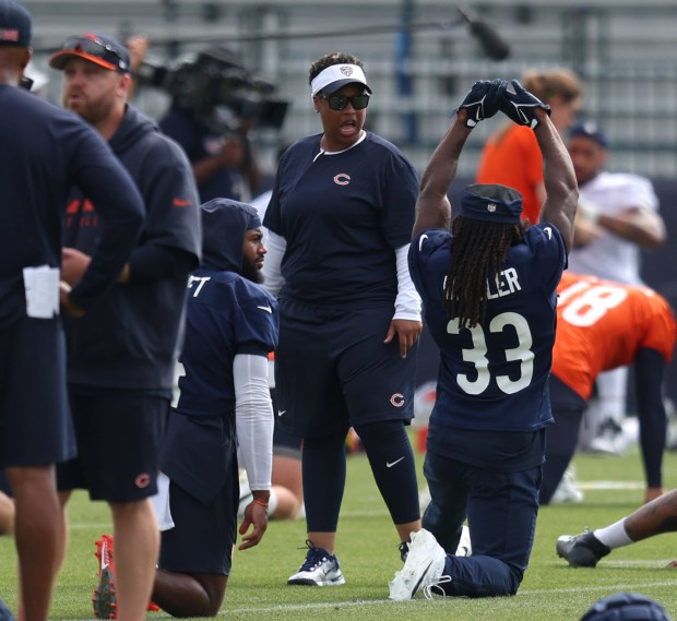 Bears assistant running backs coach Jennifer King speaks with running back Ian Wheeler (33) during training camp at Halas Hall on July 22, 2024, in Lake Forest. (Stacey Wescott/Chicago Tribune)