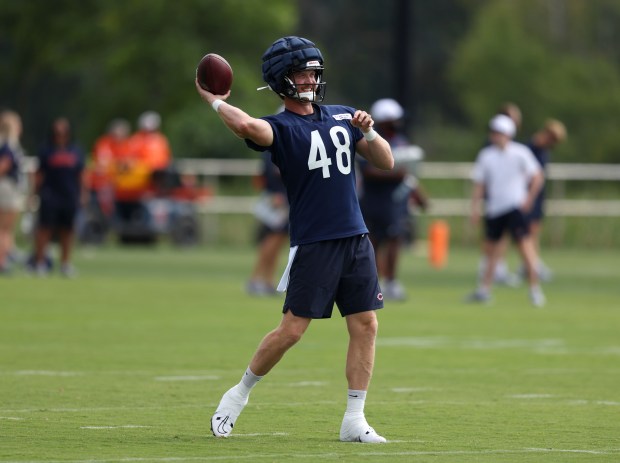 Bears long snapper Patrick Scales (48) throws the ball back during training camp at Halas Hall on July 22, 2024, in Lake Forest. (Stacey Wescott/Chicago Tribune)