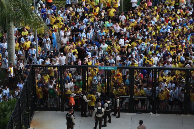 Large crowds of fans try to enter Hard Rock Stadium amid disturbances before the Copa America final between Argentina and Colombia on July 14, 2024, in Miami Gardens, Fla. (Megan Briggs/Getty Images)