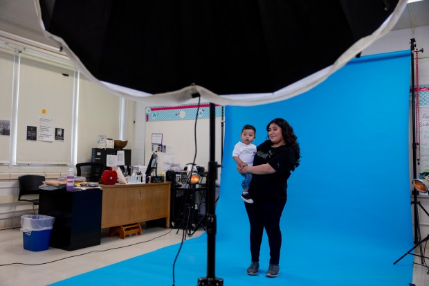 Simpson student Rosario Catinac poses for a photo with her son during an Empowerment Experience event at Simpson Academy for Young Women in Chicago on April 24, 2024. The event was meant to empower students who are mothers or are expecting a child. (Vincent Alban/Chicago Tribune)