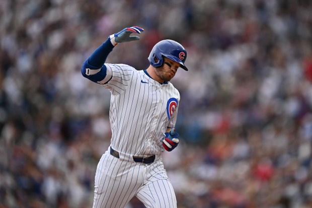 Ian Happ of the Cubs rounds the bases after hitting a three-run home run, his second of the game, in the fifth inning against the Phillies on Thursday, July 4, 2024, at Wrigley Field. (Jamie Sabau/Getty Images)