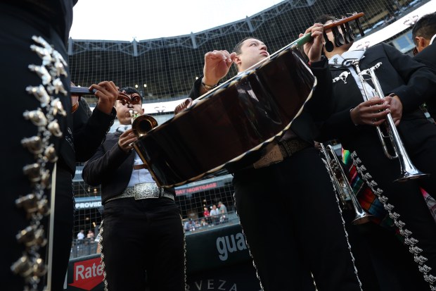 Members of Mariachi Monumental de Mexico warm up for a performance during Mexican Heritage Night at Guaranteed Rate Field before a game between the White Sox and Dodgers Wednesday, June 26, 2024, in Chicago. (John J. Kim/Chicago Tribune)