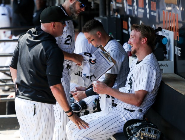 Chicago White Sox manager Pedro Grifol speaks to starting pitcher Erick Fedde after Fedde pitched five scoreless innings against the Minnesota Twins at Guaranteed Rate Field on July 10, 2024. (Eileen T. Meslar/Chicago Tribune)