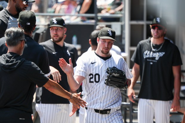 Chicago White Sox starting pitcher Erick Fedde gets high-fives from teammates after pitching five scoreless innings against the Minnesota Twins at Guaranteed Rate Field on July 10, 2024. (Eileen T. Meslar/Chicago Tribune)