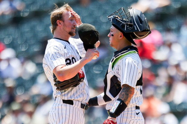 Chicago White Sox pitcher Erick Fedde (20) reacts as catcher Korey Lee (26) speaks to him after Fedde gave up a walk to load the bases during the first inning against the Minnesota Twins at Guaranteed Rate Field on July 10, 2024. (Eileen T. Meslar/Chicago Tribune)