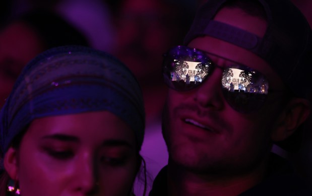 A concertgoer's sunglasses reflects the stage as Black Pumas perform during Pitchfork Music Festival at Union Park Friday, July 19, 2024, in Chicago. (John J. Kim/Chicago Tribune)