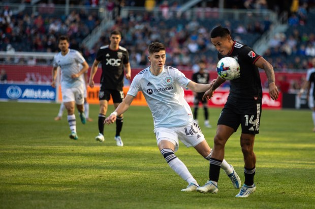 Fire midfielder Brian Gutiérrez, left, and D.C. United's Andy Najar on June 18, 2022, at Soldier Field. (Vincent D. Johnson/for the Chicago Tribune)