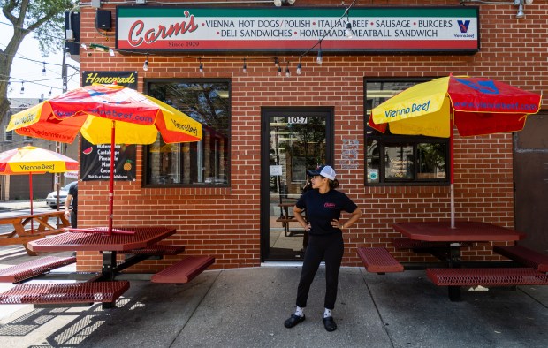 Beatriz Martinez of Carm's Beef stands outside the shop in Chicago on July 25, 2024. (Tess Crowley/Chicago Tribune)