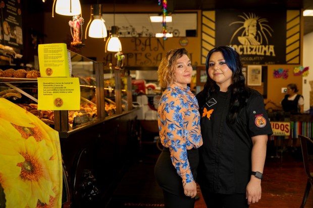 Lizette Espinoza, left, and Marisol Espinoza, right, co-owners and sisters, pose for a portrait together on July 13, 2024, at Pan Artesanal Bakery in Chicago. (Vincent Alban/for the Chicago Tribune)