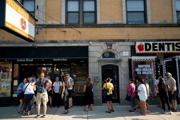 Customers wait on line prior to the bakery opening on July 13, 2024, at Pan Artesanal Bakery in Chicago. (Vincent Alban/for the Chicago Tribune)