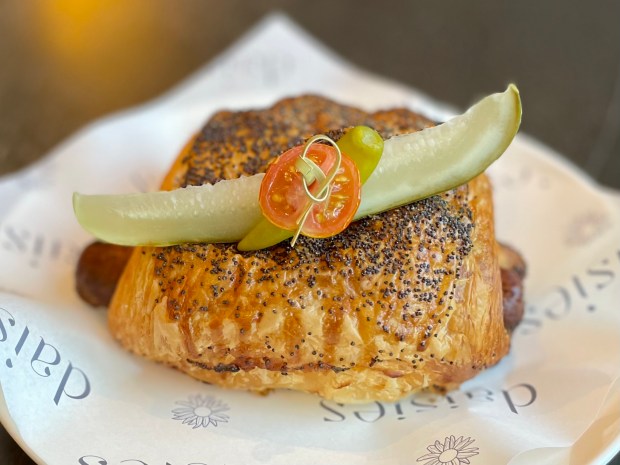 Chicago-style hot dog croissant at Daisies in the Logan Square neighborhood of Chicago (Louisa Kung Liu Chu/Chicago Tribune)