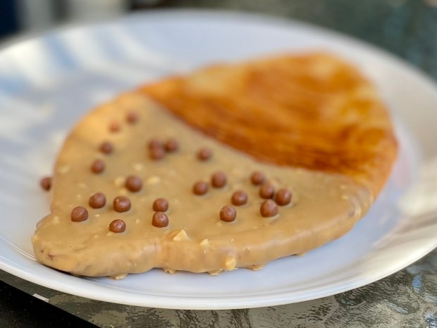 Hazelnut, caramel and milk chocolate flat croissant at Sweet Moon Cafe & Bakery in the Lincoln Square neighborhood of Chicago on June 10, 2024 (Louisa Kung Liu Chu/Chicago Tribune)