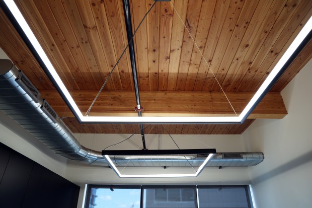 The Summit Design + Build, a mixed-use heavy timber building in Fulton Market, has a wood ceiling, July 18, 2024. (Terrence Antonio James/Chicago Tribune)