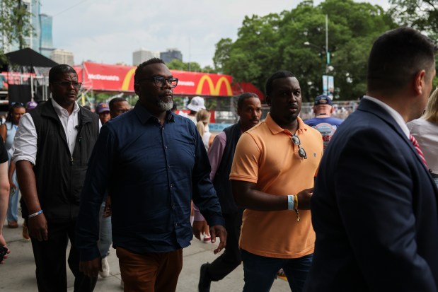 Mayor Brandon Johnson walks near pit road during the NASCAR Chicago Street Race in Grant Park on July 7, 2024. (Eileen T. Meslar/Chicago Tribune)