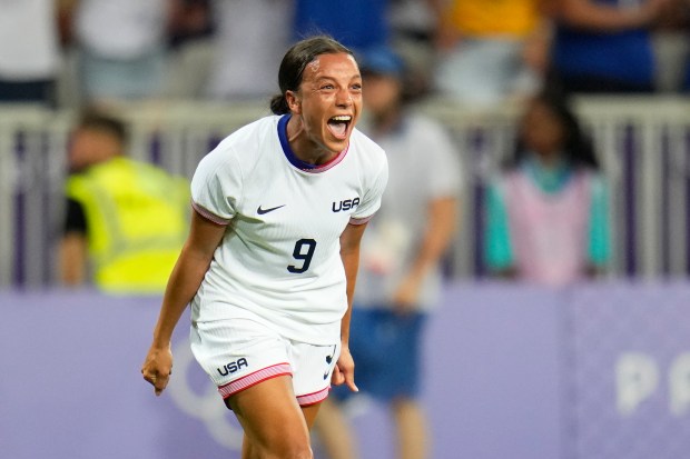 Mallory Swanson reacts after teammate Trinity Rodman scored the first U.S. goal during an Olympic Group B match against Zambia on Thursday, July 25, 2024, in Nice, France. Swanson later scored twice within 70 seconds in the 3-0 U.S. win. (AP Photo/Julio Cortez)