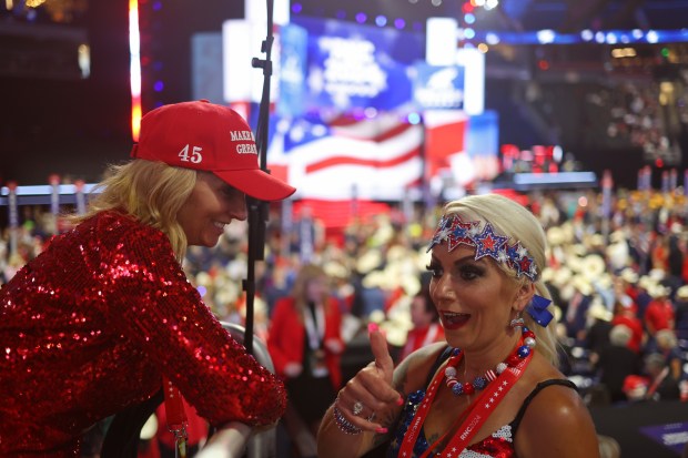 Illinois alternate delegates Tina McGrath, left, and Petrina Burman talk during Thursday's Republican National Convention session at Fiserv Forum on July 18, 2024, in Milwaukee. (John J. Kim/Chicago Tribune)